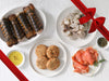 Crab Cakes, Lobster Tails, Shrimp, and Smoked Salmon on Plates with Gift Ribbon