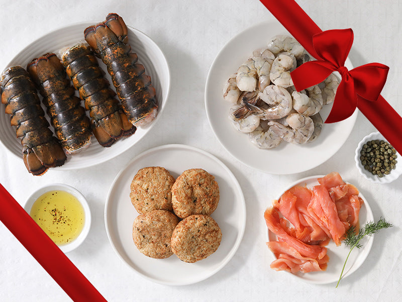 Crab Cakes, Lobster Tails, Shrimp, and Smoked Salmon on Plates with Gift Ribbon