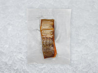 Bacl of Hot Smoked Steelhead Trout in Package on Ice