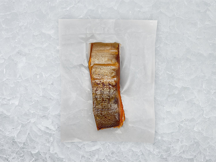 Bacl of Hot Smoked Steelhead Trout in Package on Ice