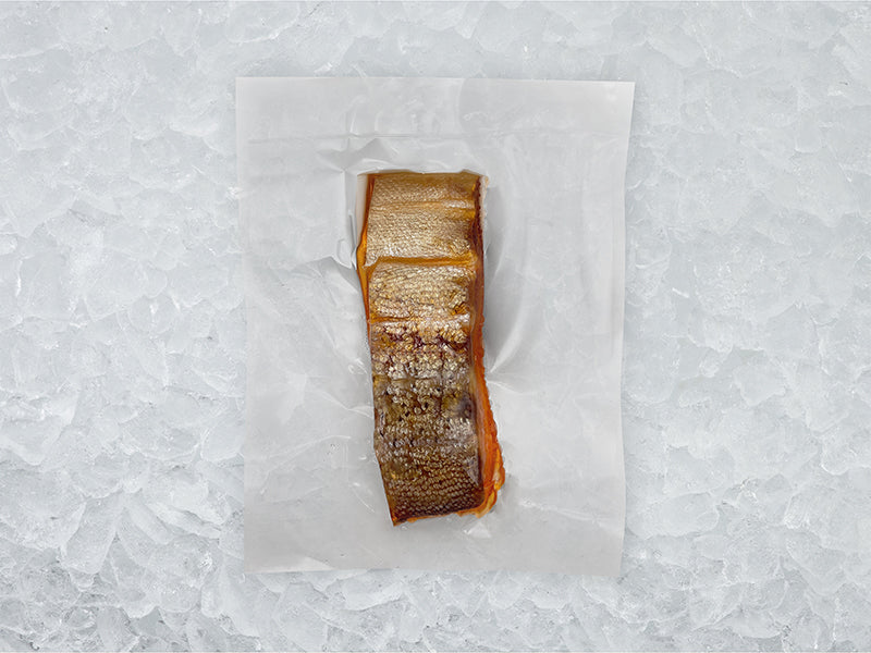 Bacl of Hot Smoked Steelhead Trout in Package on Ice