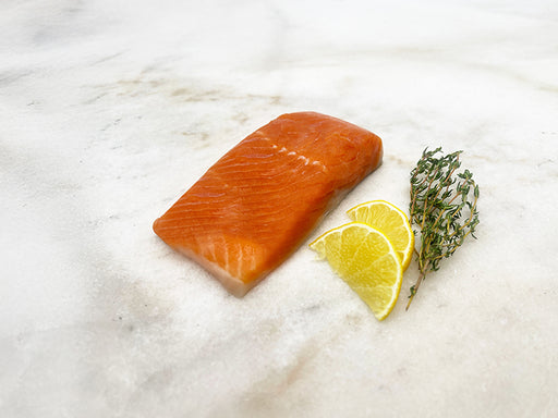 Arctic Char Portion on Marble with Lemon and Herbs