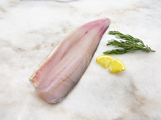 Walleye Fillet on Marble with Lemon and Herbs