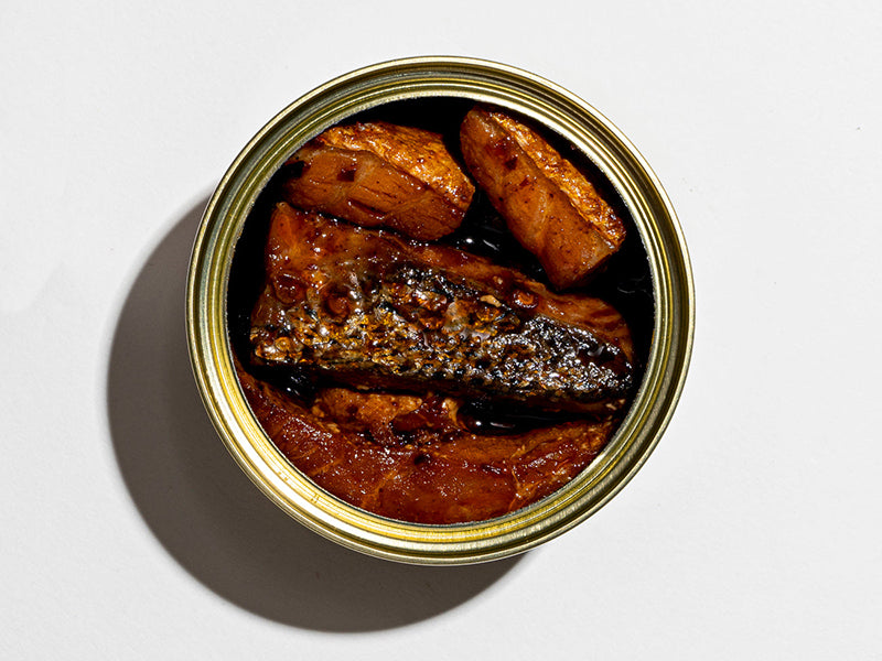 Close Up Fishwife Smoked Salmon with Fly By Jing Chili Crisp Open Tin on White Background