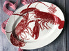 Red Lobsters Oval Rimmed Platter on Wood Table with Red and White Striped Ribbon