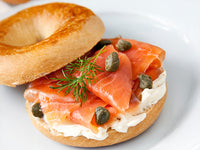 Smoked Salmon on Plain Bagel with Cream Cheese and Capers on Top