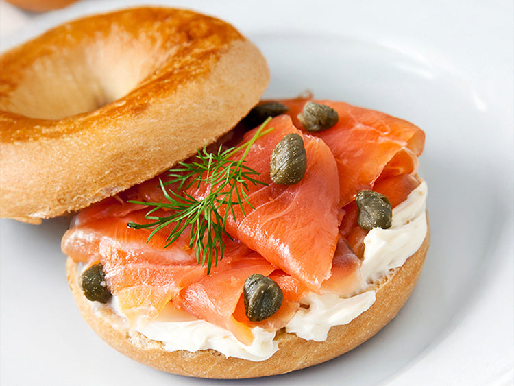 Smoked Salmon on Plain Bagel with Cream Cheese and Capers on Top
