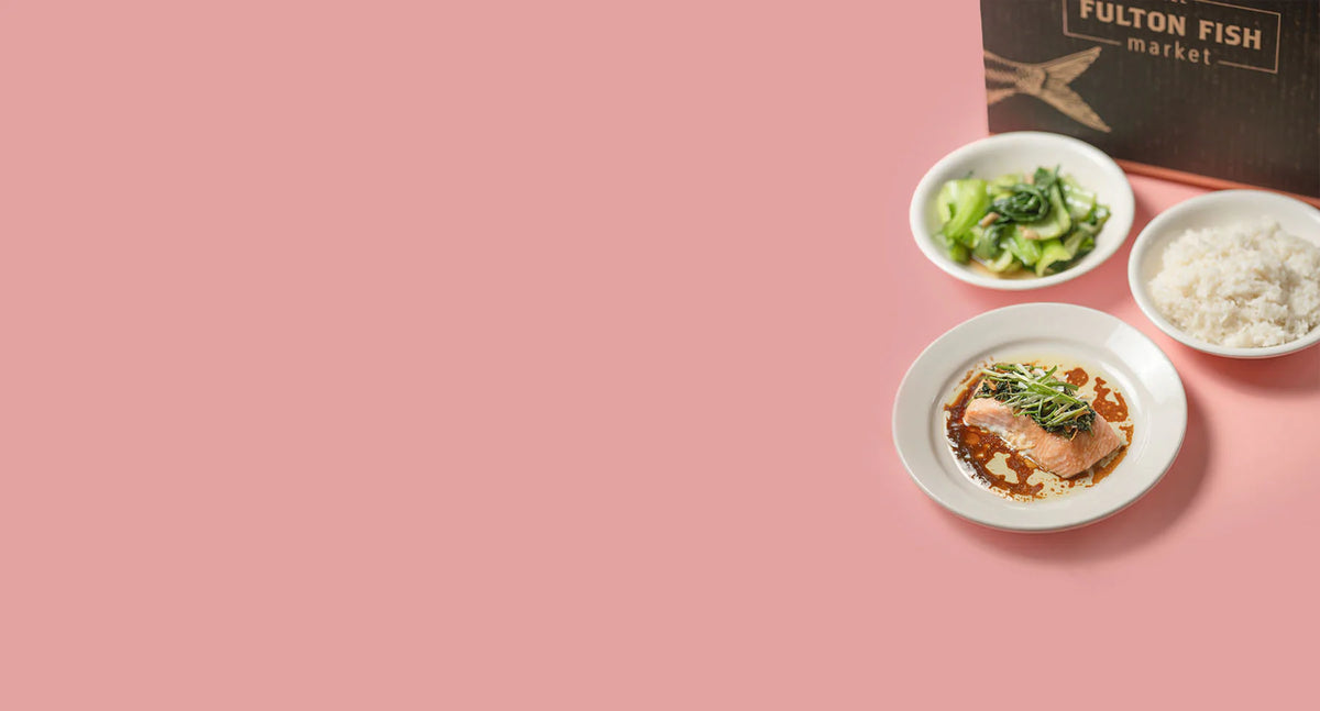 Cooked Salmon on Plate with Salad and Rice on Pink Background next to a Fulton F