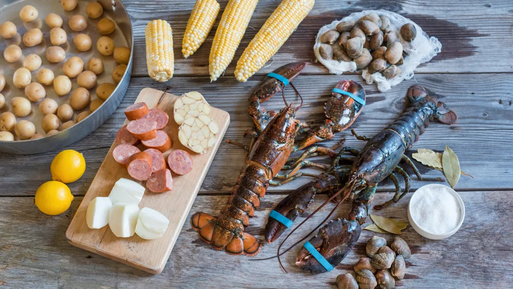 Lobster Boil Ingredients on Wood Table
