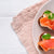 Smoked salmon canapés on a white plate with a light background