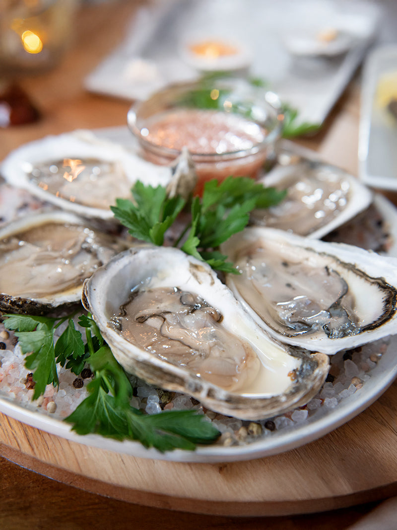 Shucked Oysters on Plate with Cocktail Sauce