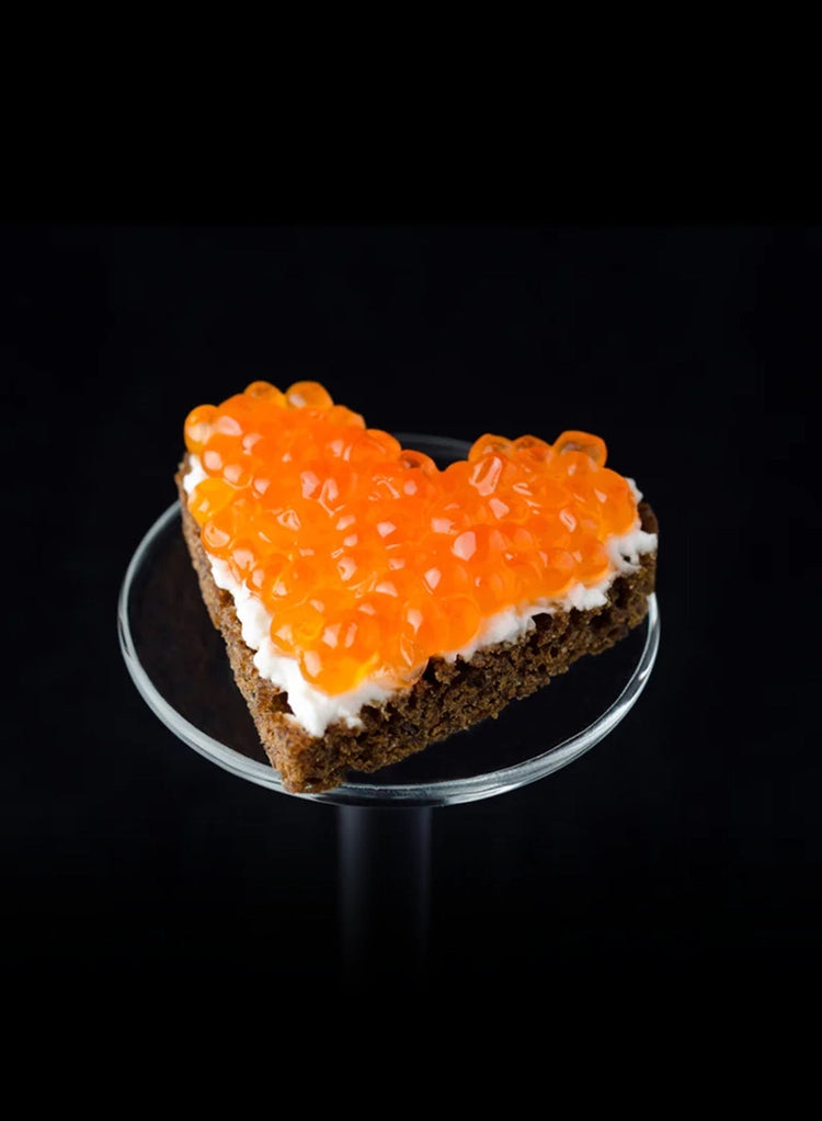 Salmon Roe On Top of Heart-Shaped Toast Point with Creme Fraiche