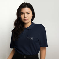 Female Model Wearing Navy Polo Shirt with White Fulton Fish Market Logo
