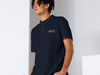 Male Model Wearing Navy Polo Shirt with White Fulton Fish Market Logo