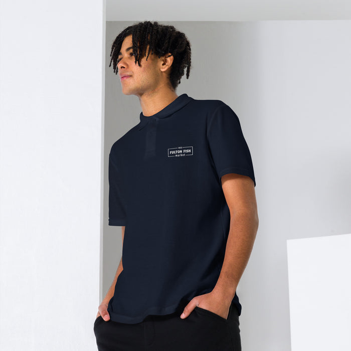 Male Model Wearing Navy Polo Shirt with White Fulton Fish Market Logo