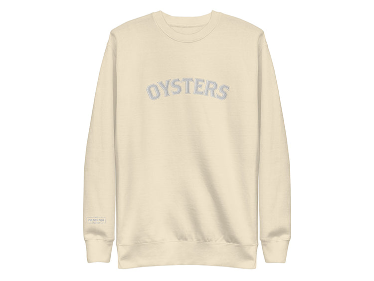 Beige sweatshirt with 'OYSTERS' text on a white background