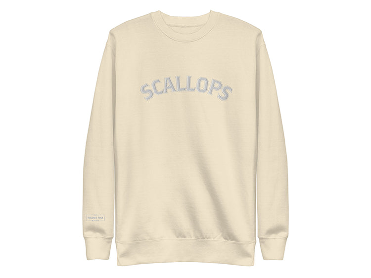 Beige sweatshirt with 'SCALLOPS' text on a white background