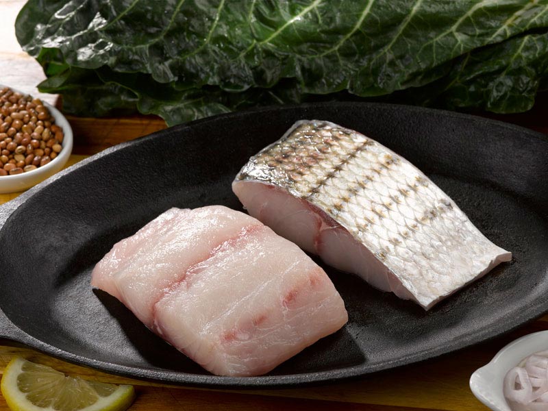 Two Wild Striped Bass Portions in Pan