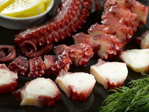 Cooked Octopus Tentacles in Pieces with Lemon and Herbs