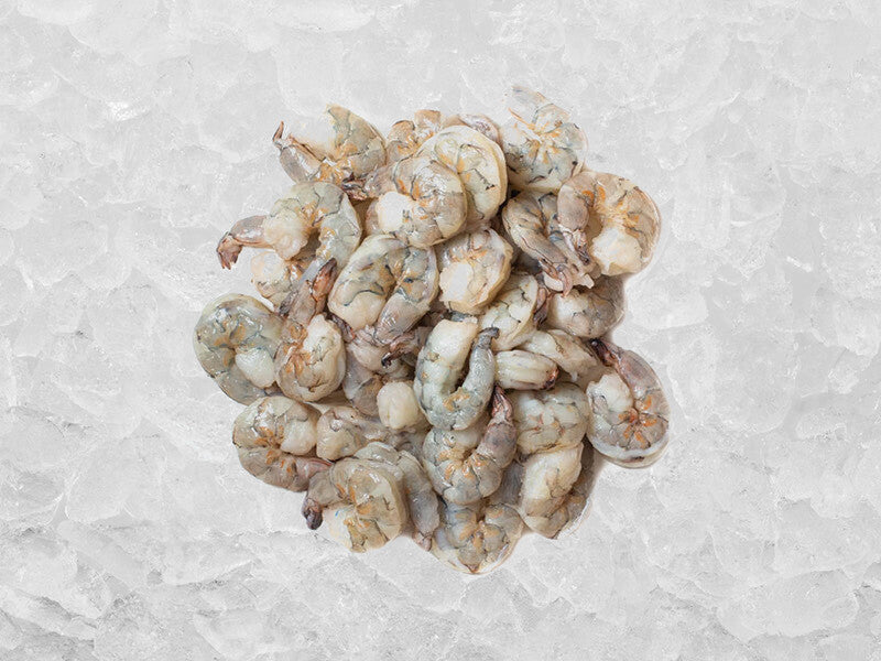 Pile of Wild Colossal Peeled & Deveined Blue Shrimp on Ice