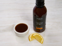 Fulton Fish Market Sesame Ginger Marinade in Small Bowl with Lemons