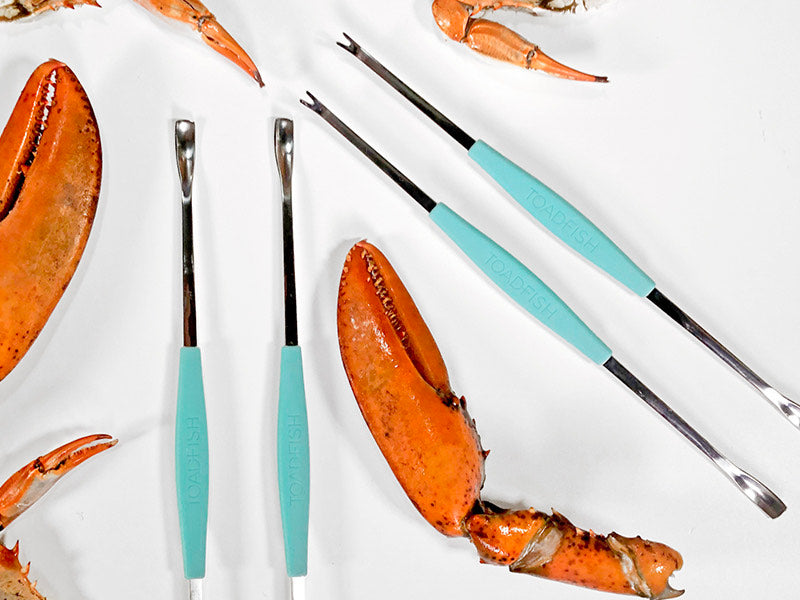 Toadfish Crab & Lobster Forks with Crab Legs on White Background