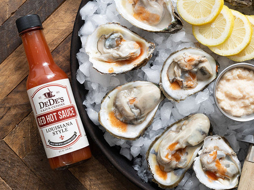 DeDe's Cajun Cuisine Red Hot Sauce Louisiana Style on Shucked Oysters over Ice with Lemons