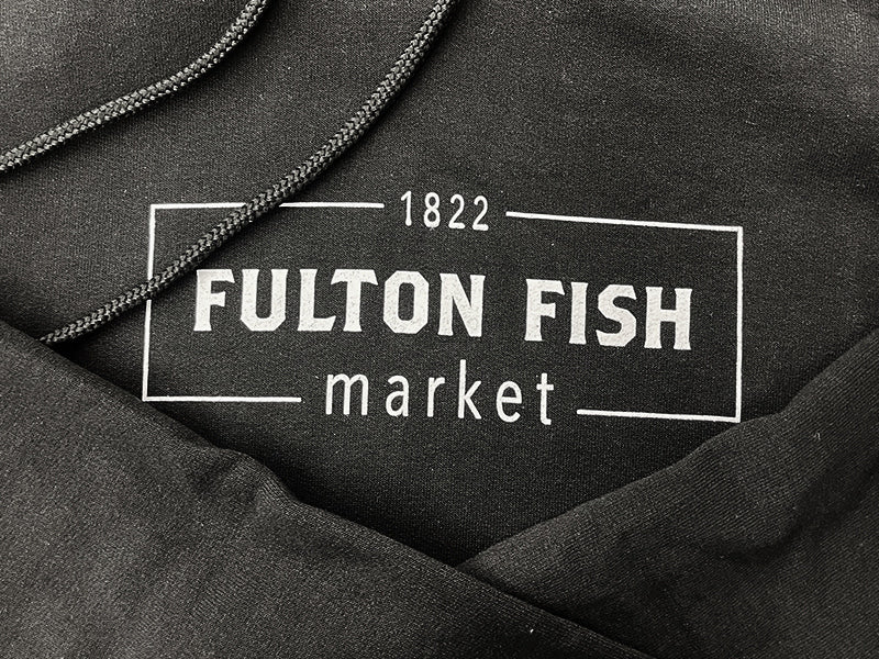 Close Up of Fulton Fish Market Logo on Sweatshirt